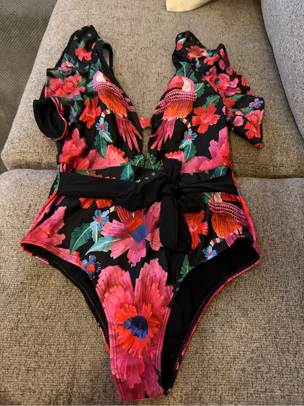 NWOTs. Hygiene liner attached. Floral multi-colored Swimsuit with Tie Waist